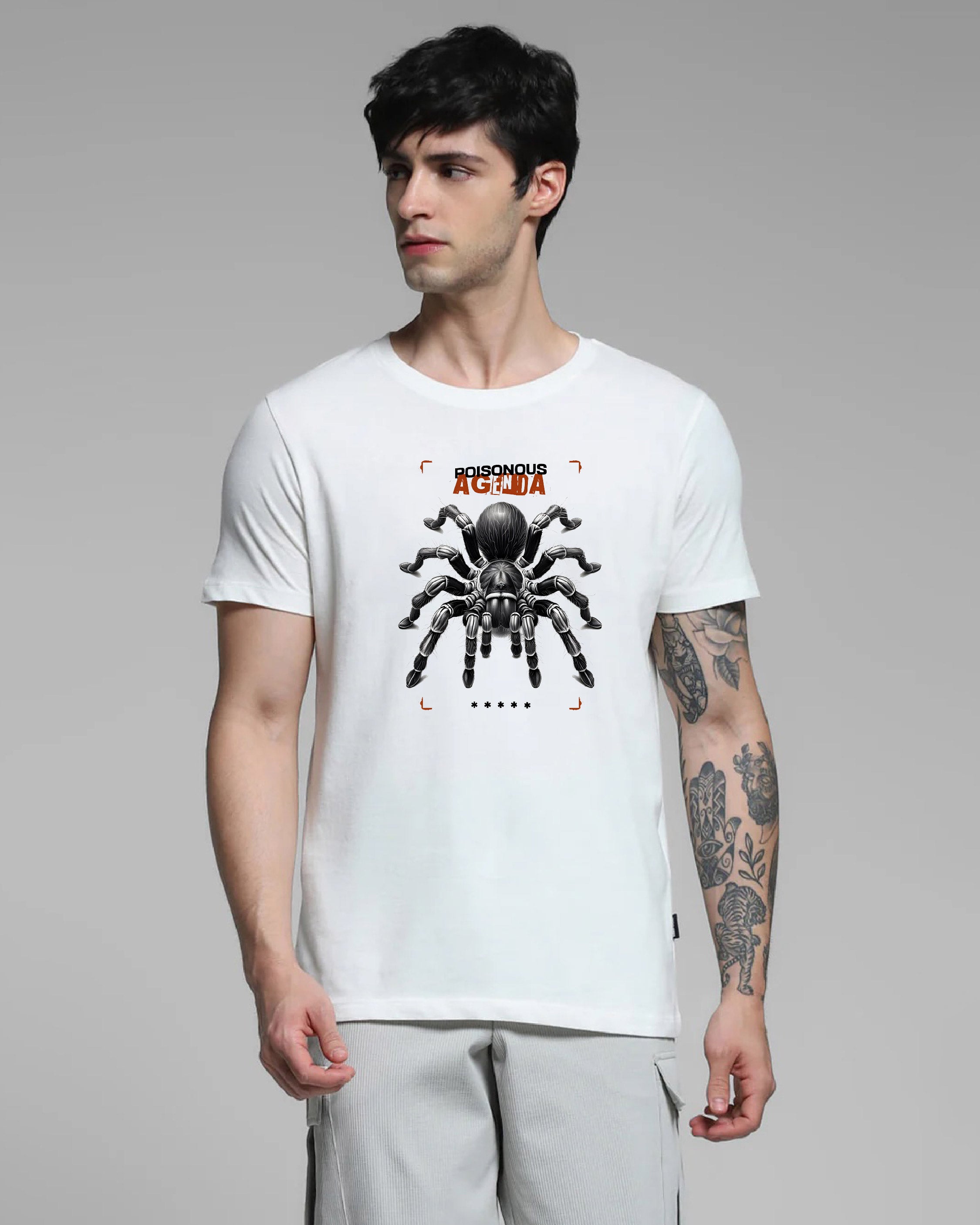 Man wearing a white t-shirt with a spider graphic and text on a gray background