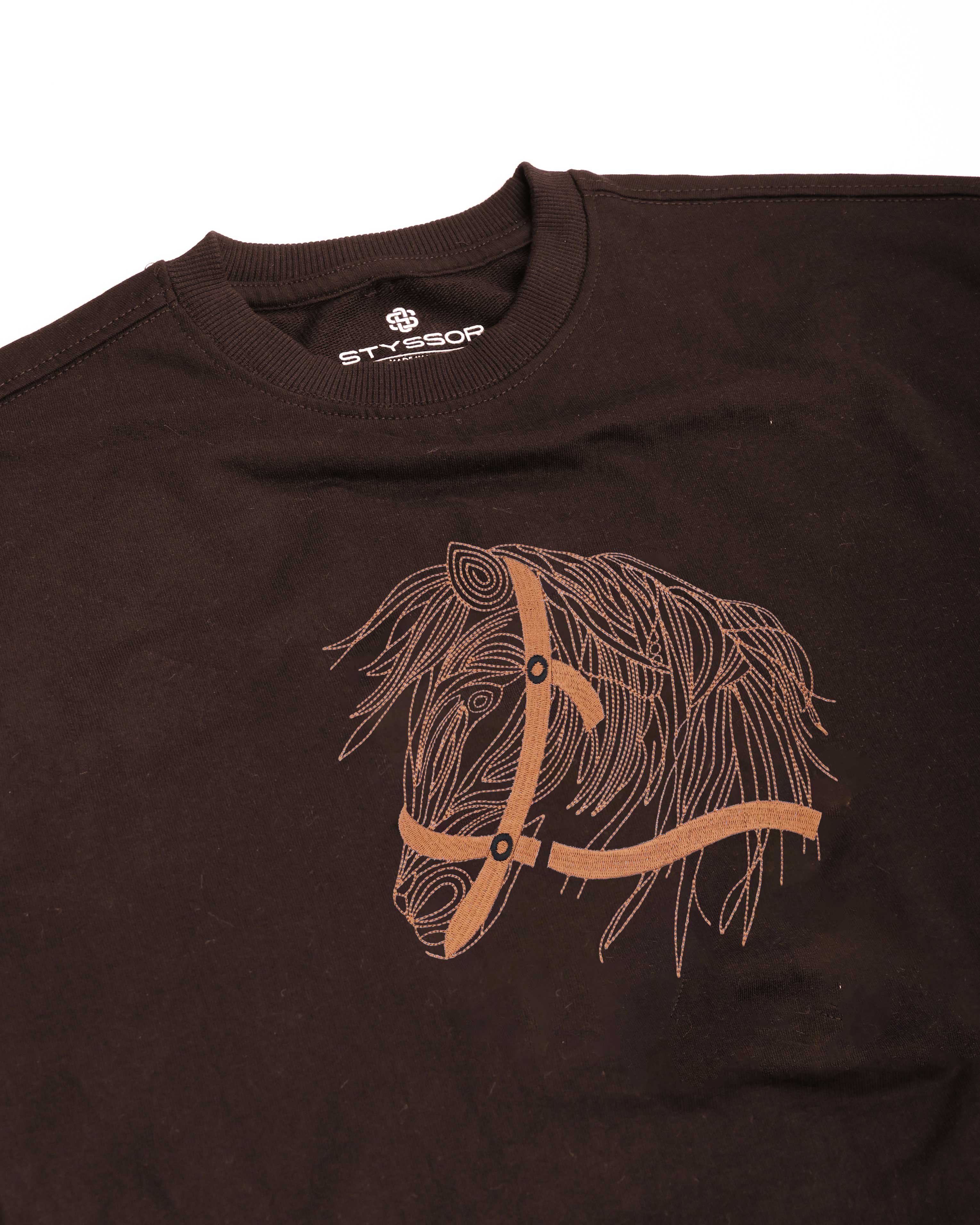 Brown t-shirt with a horse head and bridle design on a white background