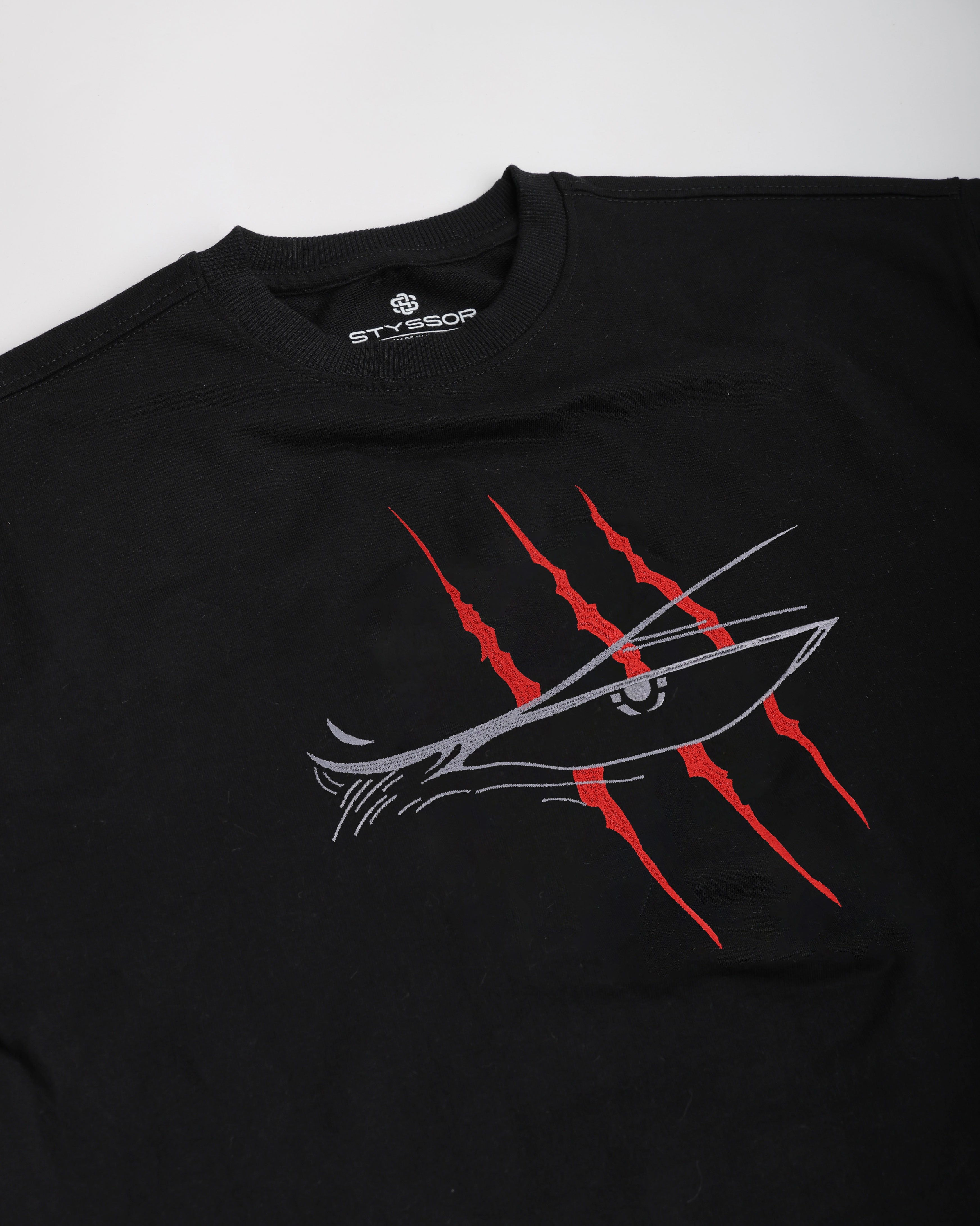 Black t-shirt with a graphic design on a white background