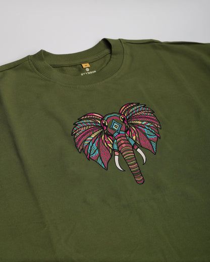 Green t-shirt with a colorful elephant design on a white background
