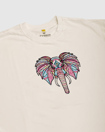 Beige t-shirt with a colorful elephant design on a white background