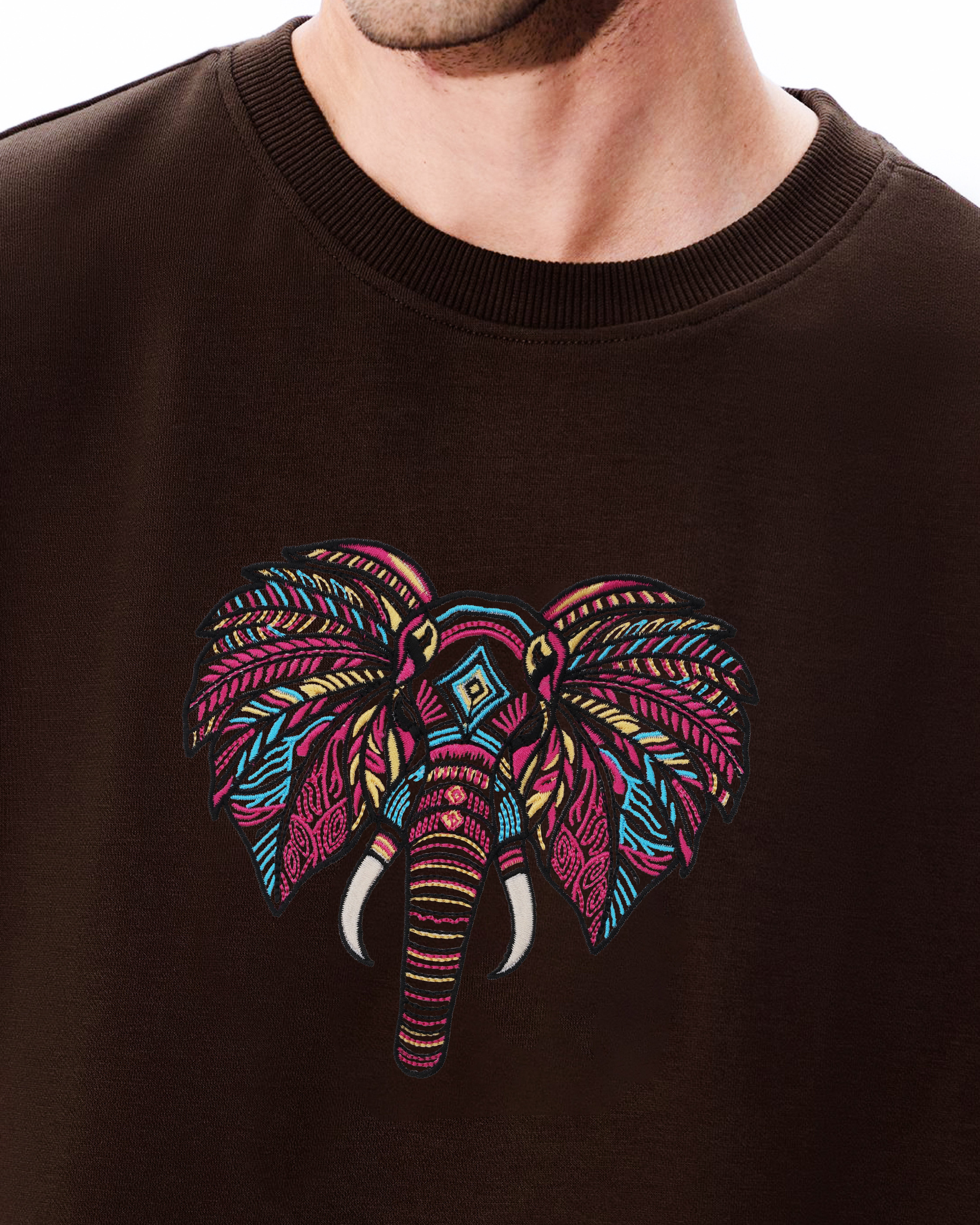 Brown sweatshirt with a colorful elephant design on a white background