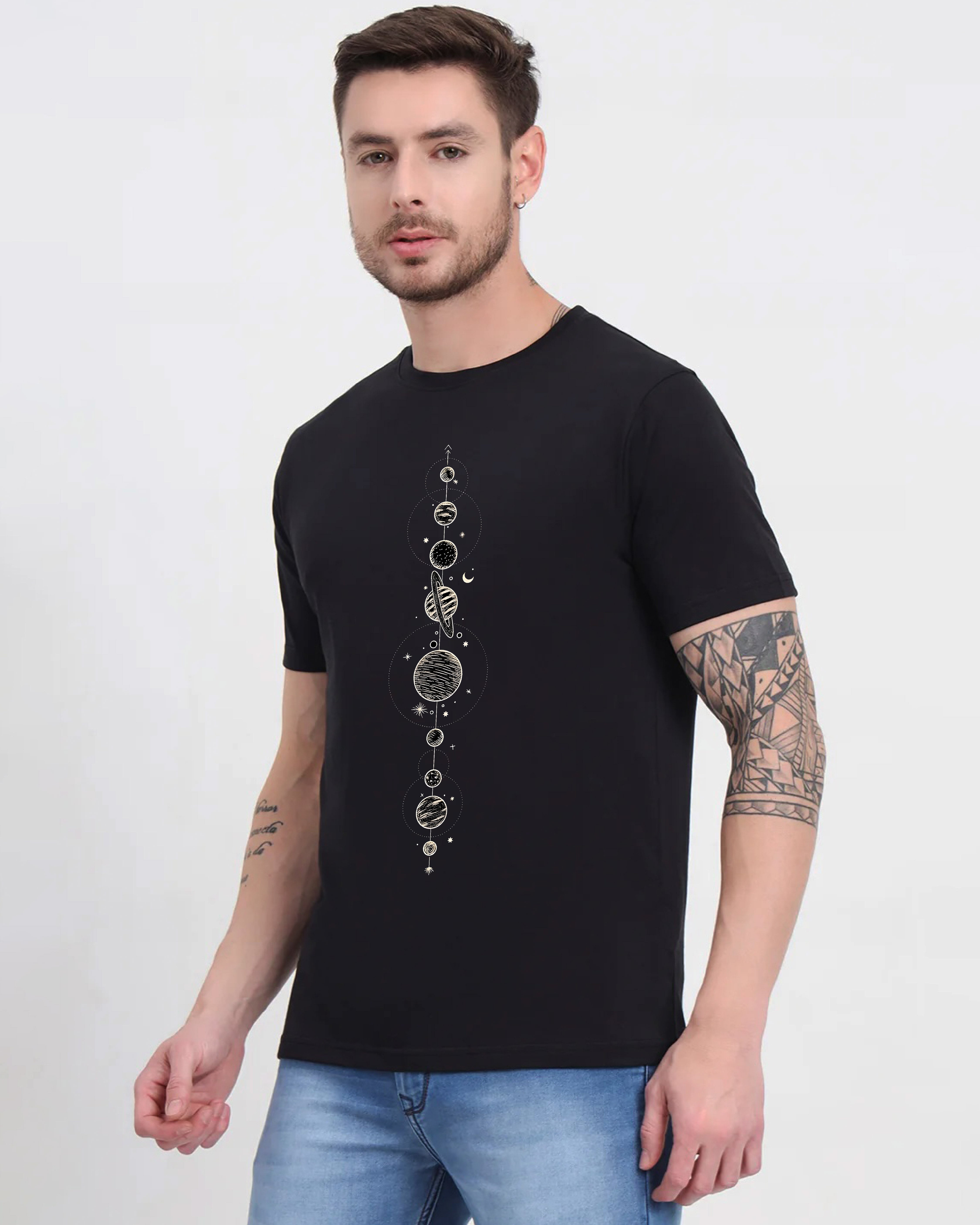 Man wearing a black t-shirt with celestial design on a white background