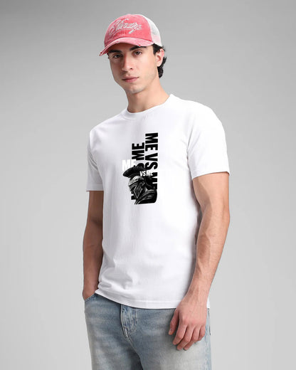 Man wearing a white t-shirt with graphic design and a red cap on a gray background