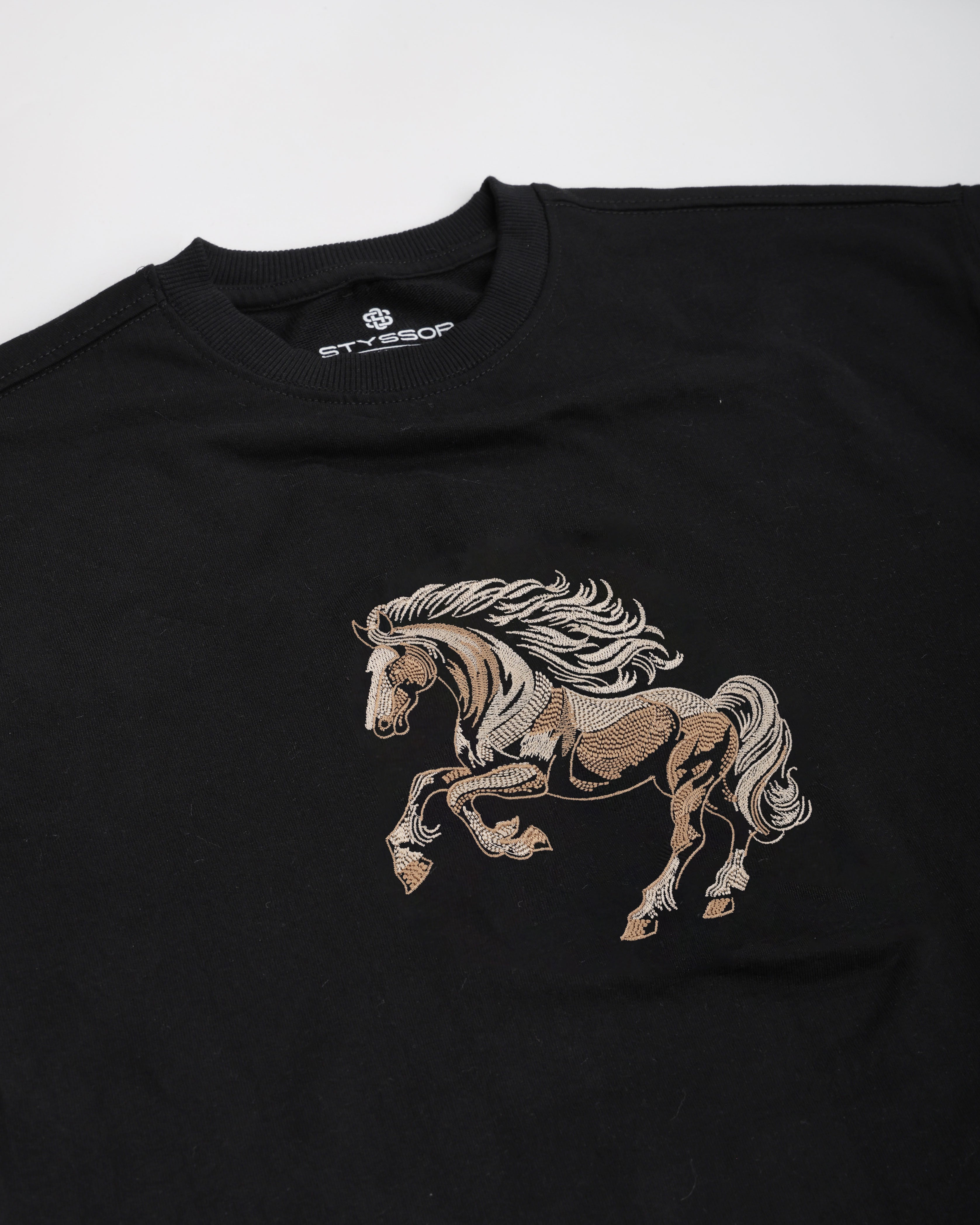 Black t-shirt with a horse embroidery design on a white background