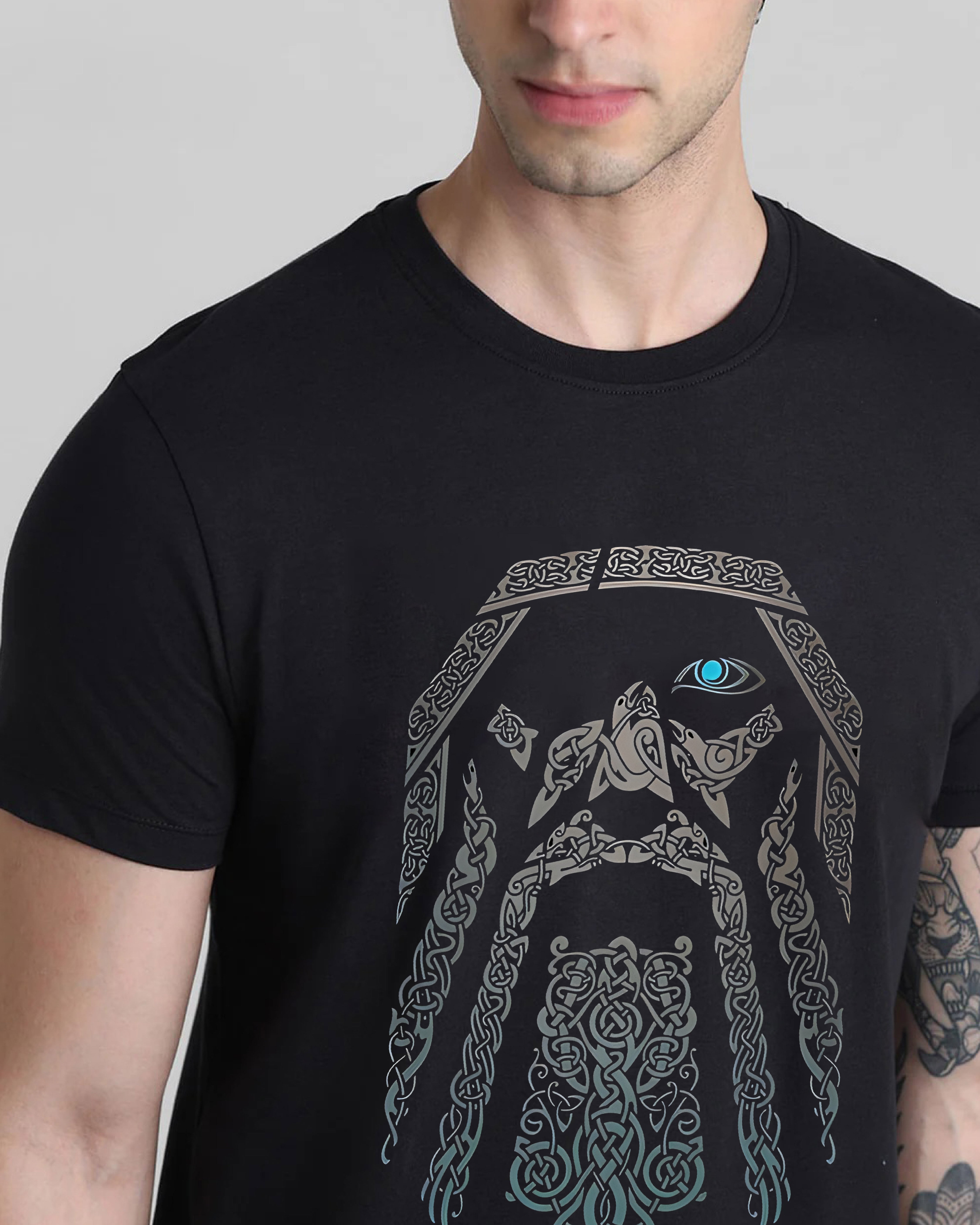 Black t-shirt with intricate design on a plain background