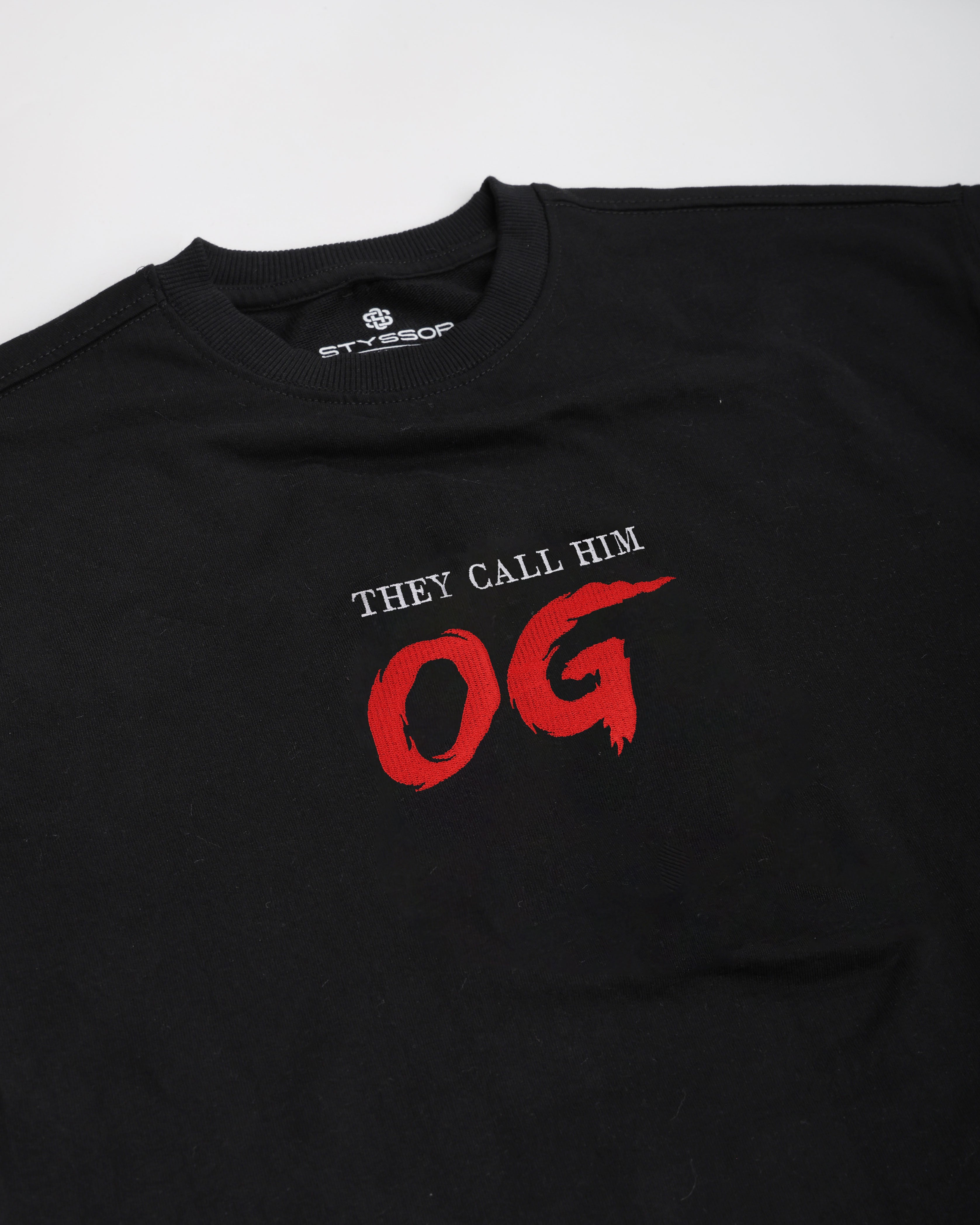 Black t-shirt with red and white text on a white background