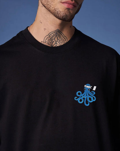 Black t-shirt with a blue octopus design on a blue background