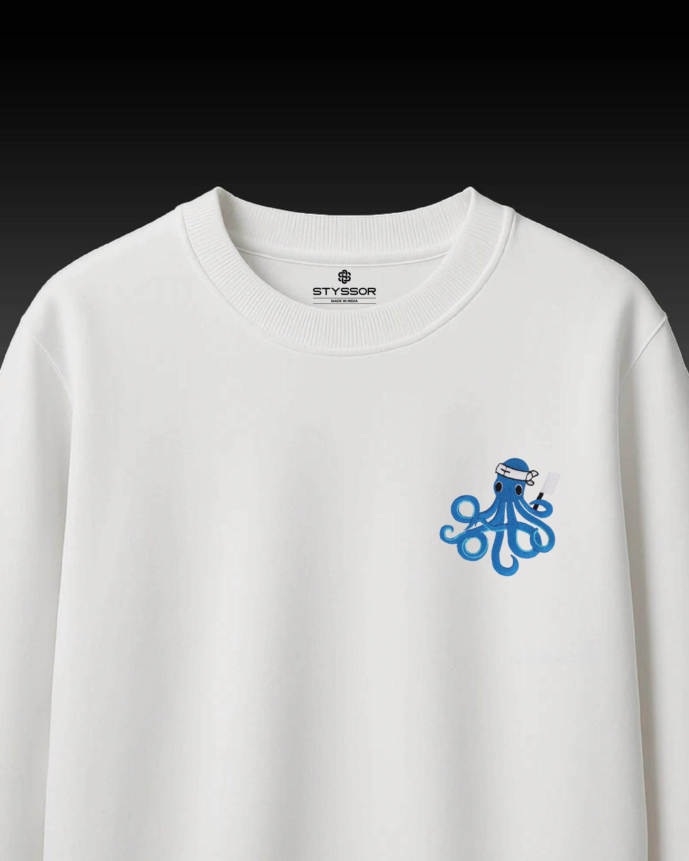 White sweatshirt with blue octopus design and 'STYSSOR' branding on a black background