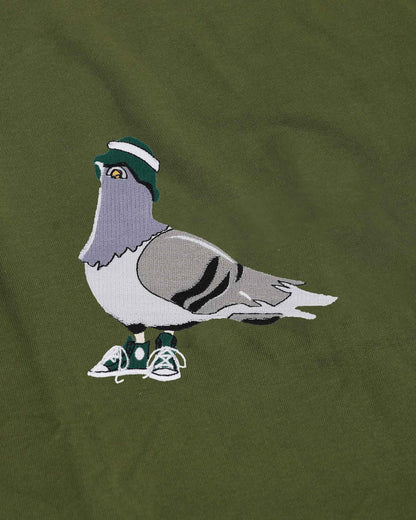 Embroidered pigeon with a hat and shoes on a green background