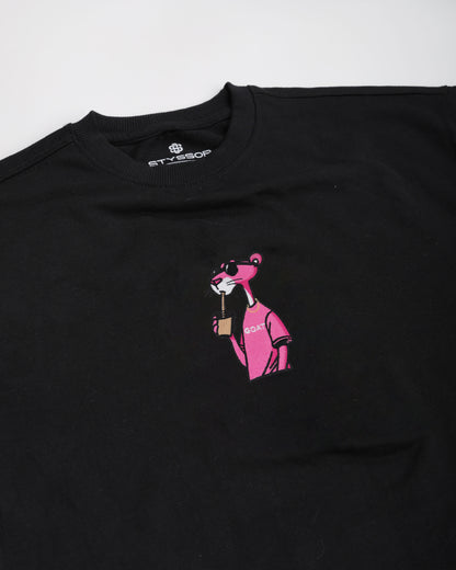 Black t-shirt with pink graphic of a dog and text on a white background