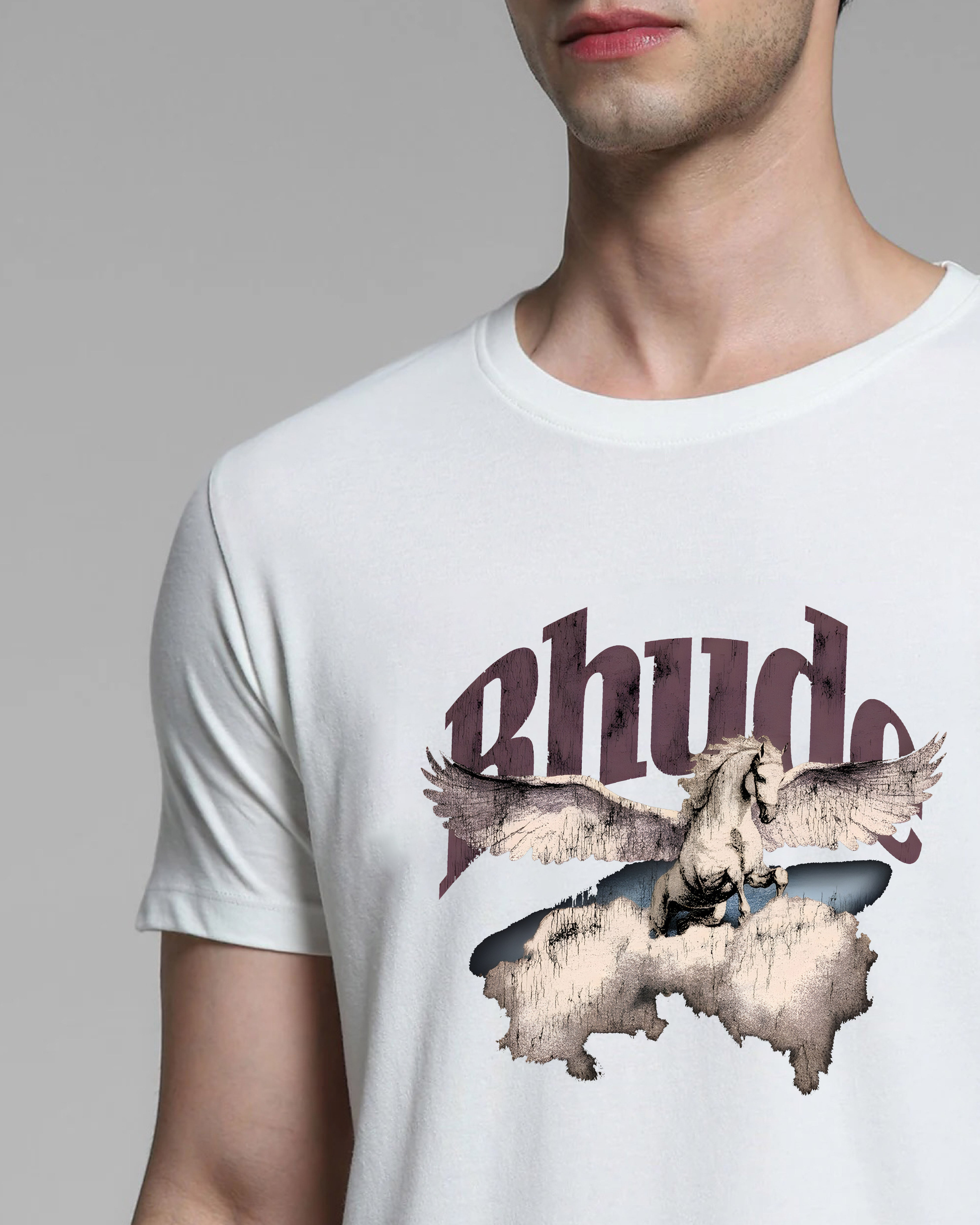 Person wearing a white t-shirt with a graphic design and text on a plain background