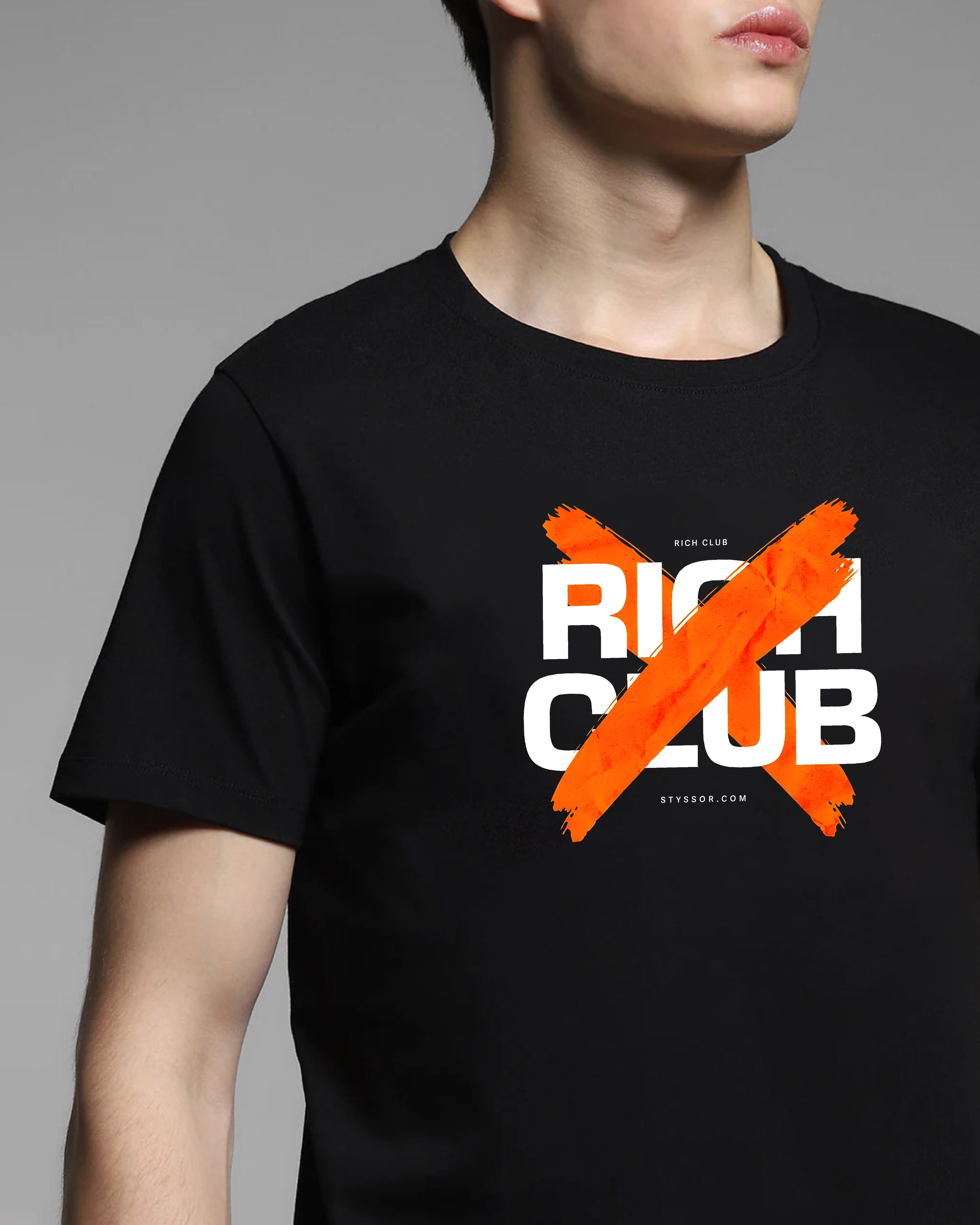 Black t-shirt with 'Rich Club' text and orange cross mark on a gray background