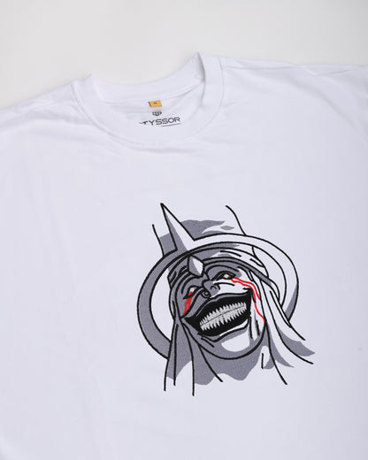 White t-shirt with a graphic design of a character with a large mouth and red eyes on a white background.