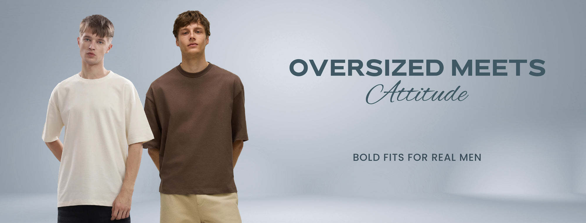 Two men wearing oversized clothing with text 'Oversized Meets Attitude' on a gray background