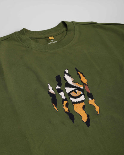 Green sweatshirt with a tiger eye design on a gray background